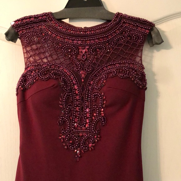 Dresses & Skirts - Maroon gown. Beaded top and back.
